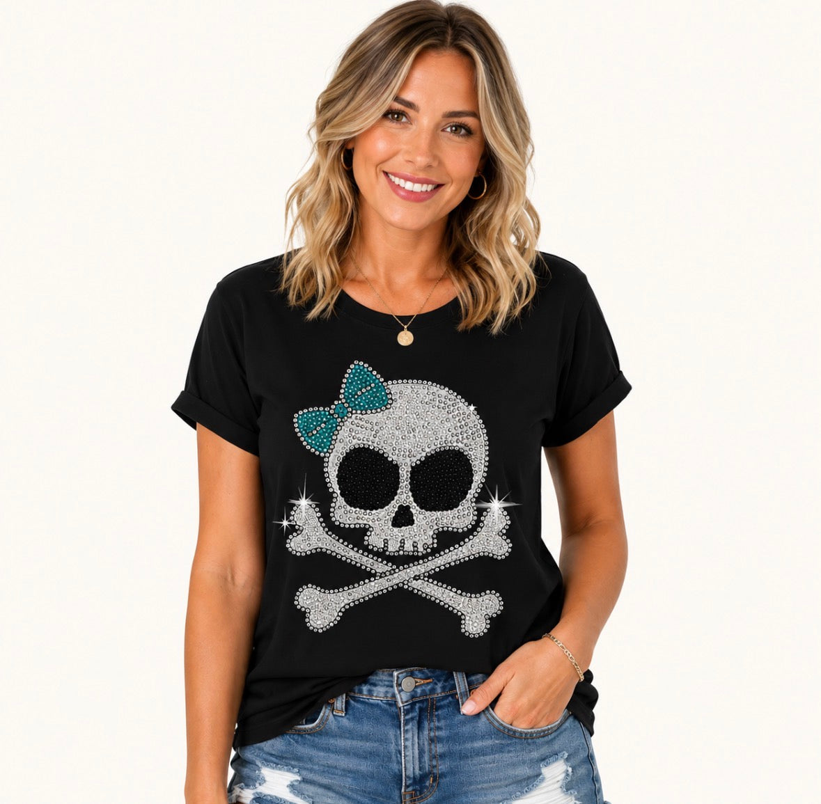Graphic T-shirt “ RHINESTONE SKULL AND CROSSBONES WITH TEAL BOW”